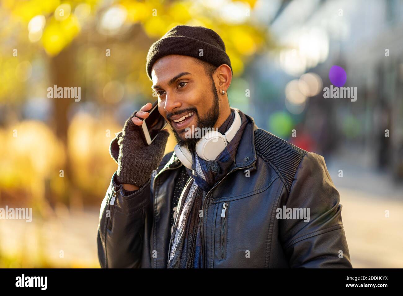 Handsome young man using mobile phone at the street Stock Photo