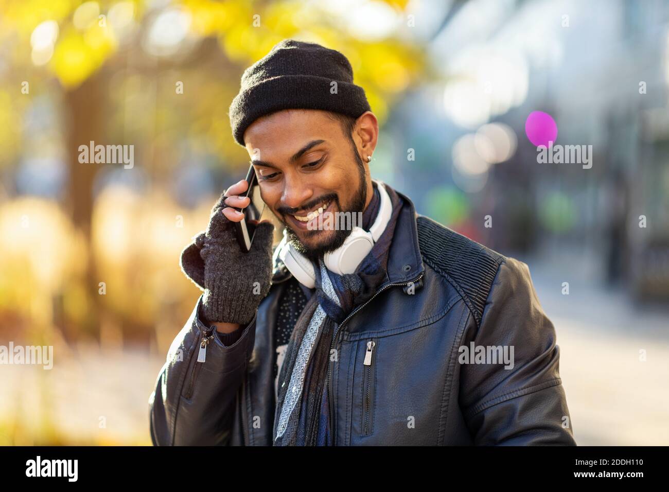 Handsome young man using mobile phone at the street Stock Photo
