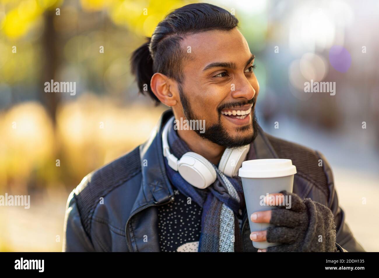 Handsome young young man drinking coffee in the street Stock Photo