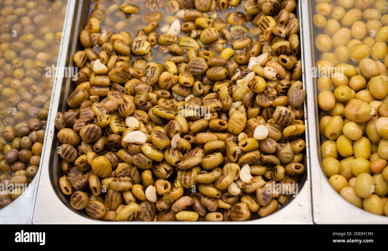 Green olives as health food preserved in olive oil Stock Photo Alamy