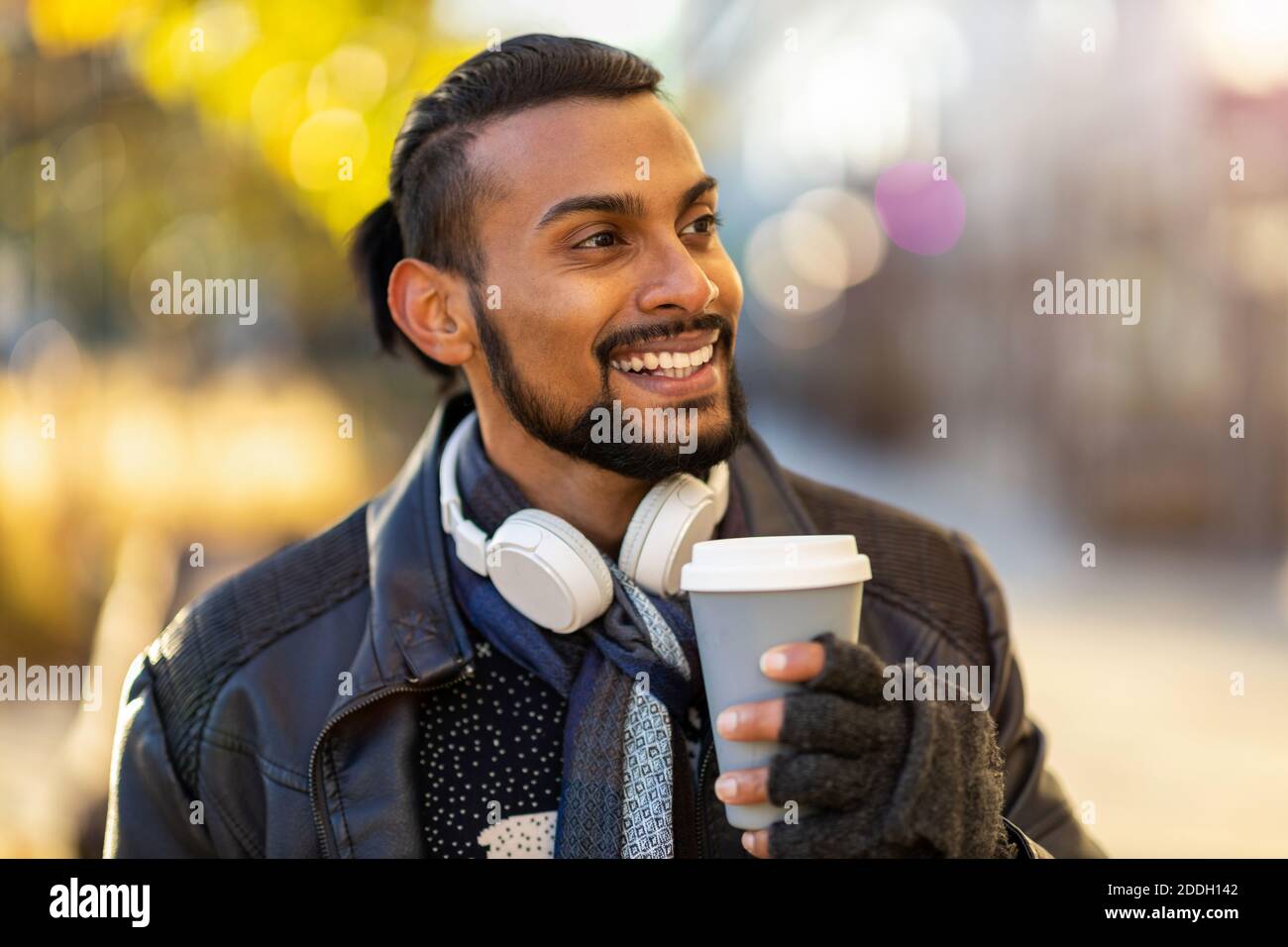 Handsome young young man drinking coffee in the street Stock Photo