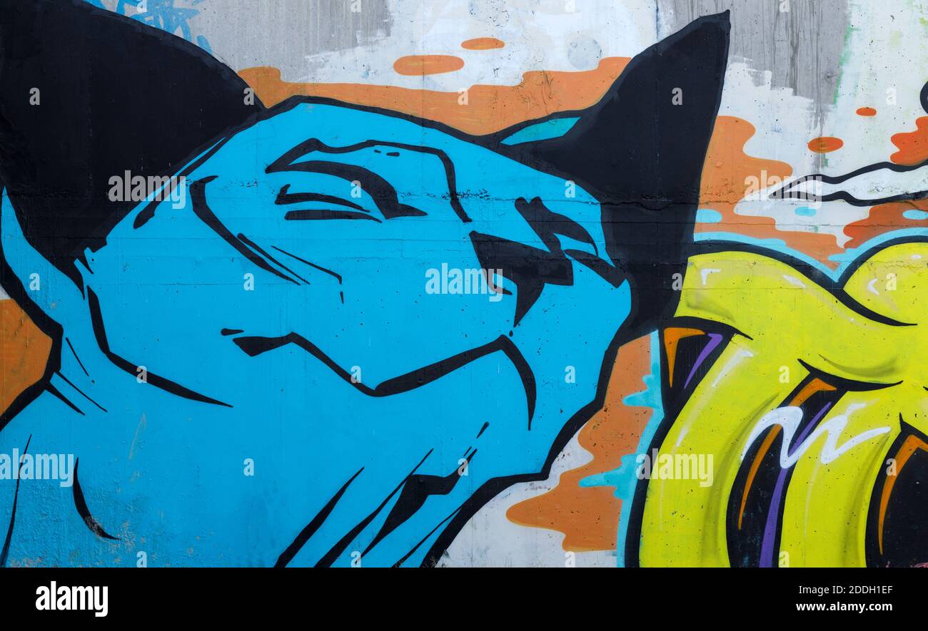 Detail from a mural of a grinning cat on an outdoor large canvas wall in Christchurch, New Zealand. Stock Photo