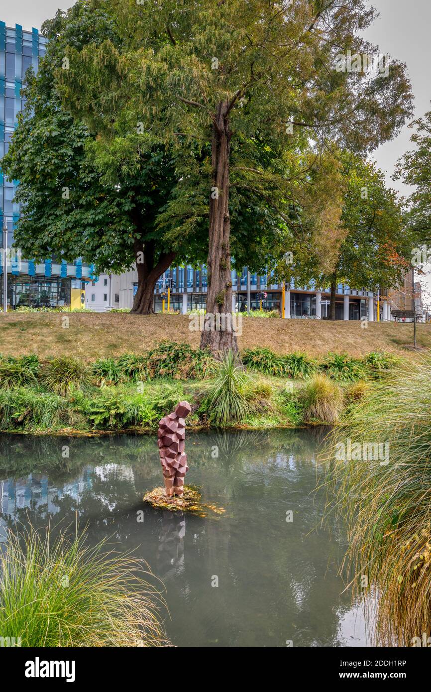 The 2015 Antony Gormley sculpture called Stay. In the Avon River and twin to another at the Arts Centre, Christchurch, New Zealand. Stock Photo