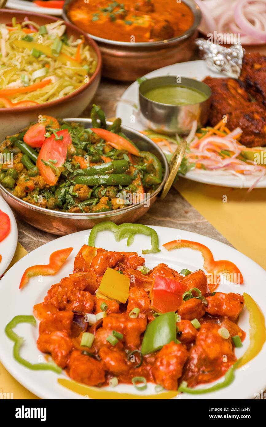 A closeup shot of Indian restaurant nonvegetarian thali with rice, puri Stock Photo Alamy