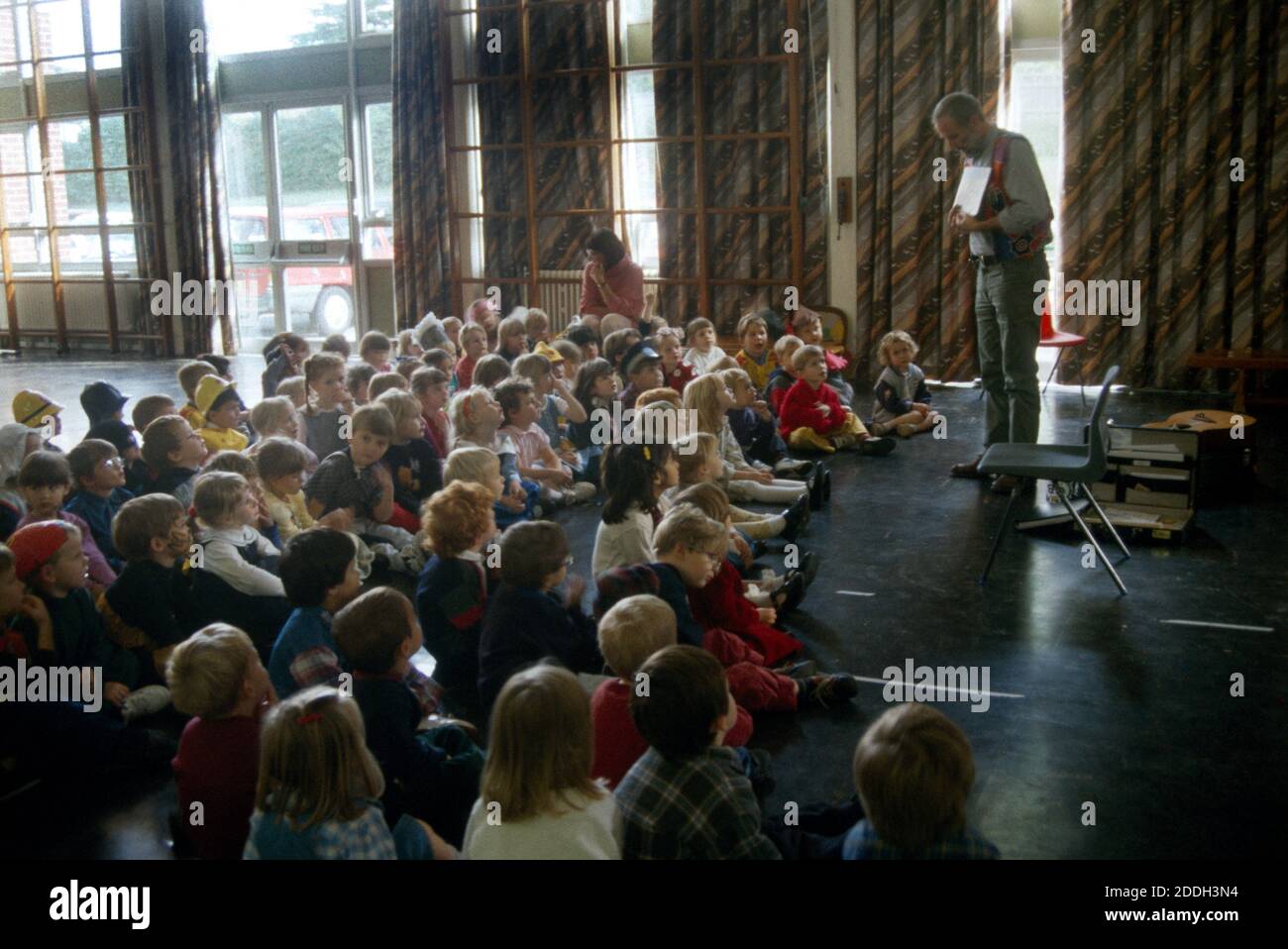Surrey England Robin Mellar Poet Speaking to Children in School Assembly Hall Stock Photo