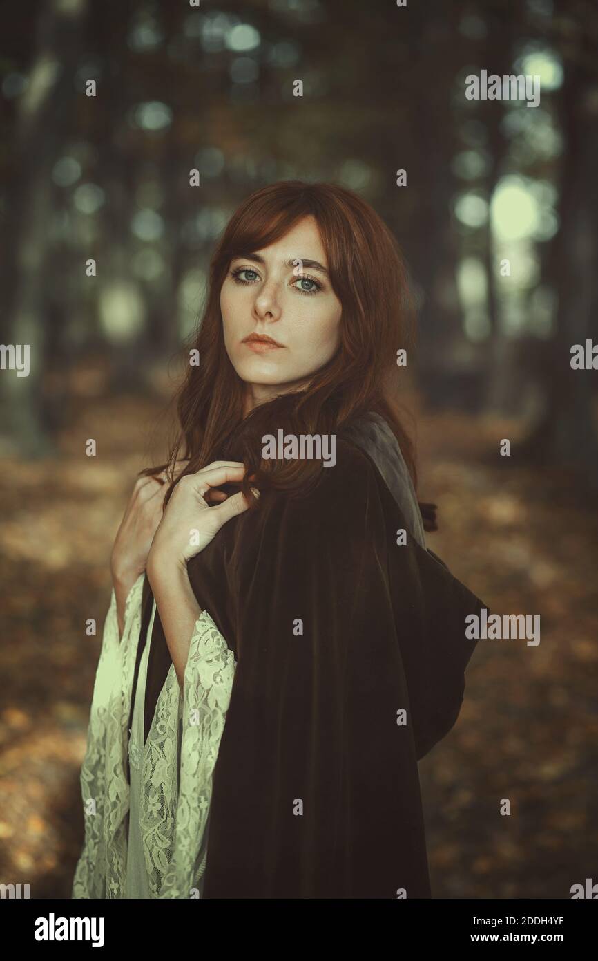 Beautiful girl with brown cloak. Outdoor portrait Stock Photo