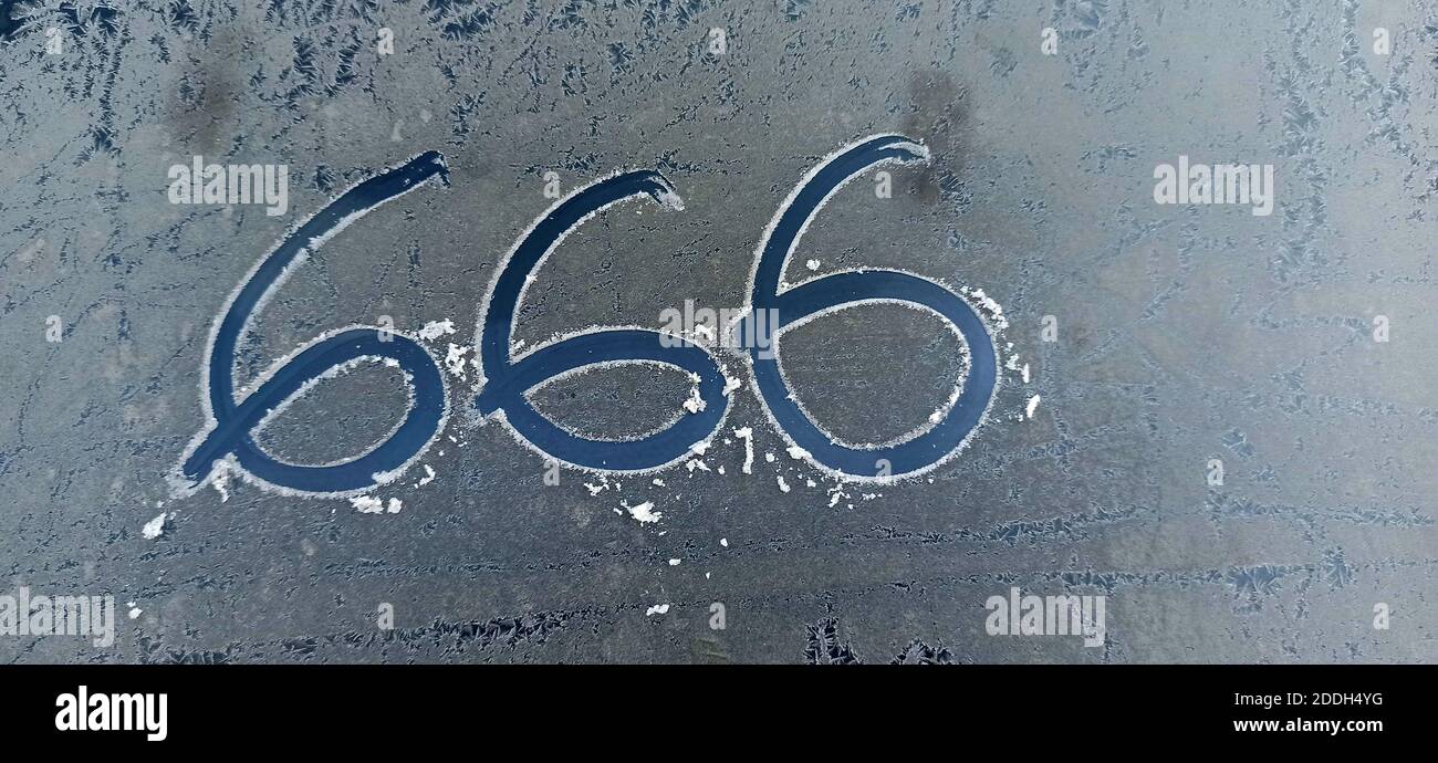 number 666 on forsty car window background. Hell, death and satan symbol Stock Photo