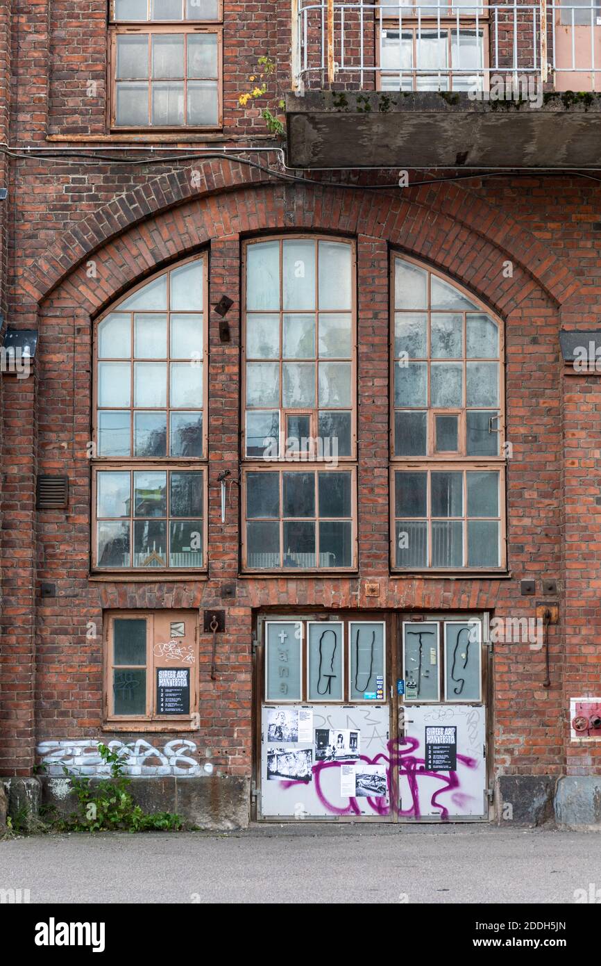 Doors and windows of an old rail engineering works in Konepaja district in Helsinki, Finland Stock Photo