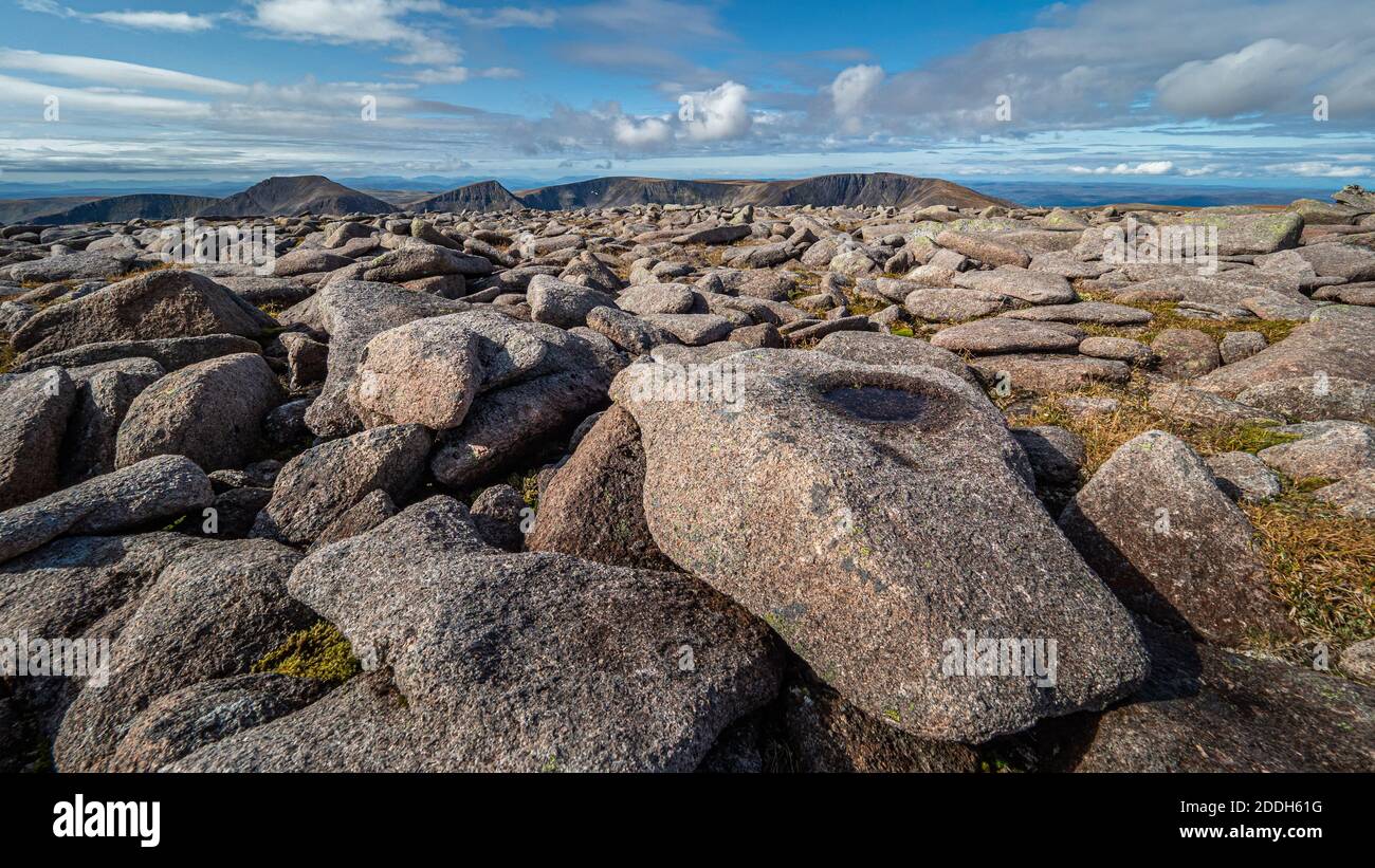 Looking out over the granite boulder field that forms part of the summit of Ben MacDui, the 2nd highest mountain in the UK, over to Braeriach Stock Photo