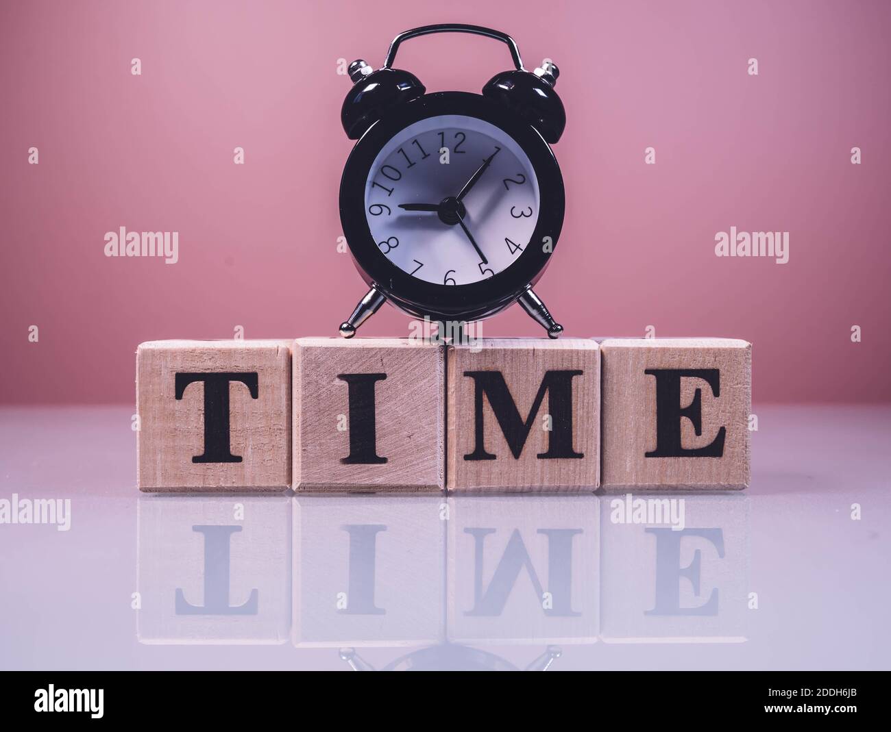 Text TIME on wood cube blocks, stock investment concept. The word TIME