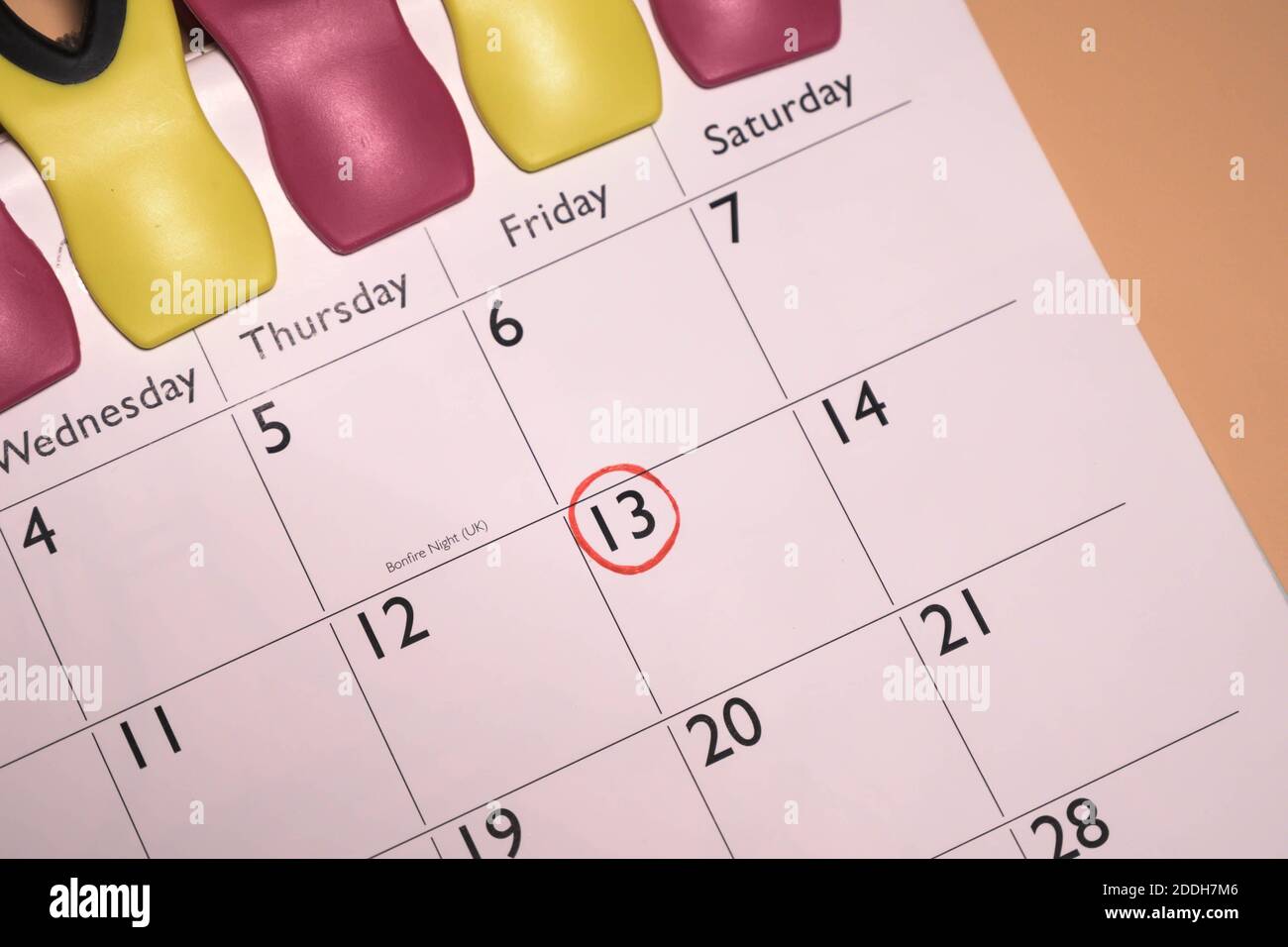 Calendar page with marked date of friday 13th Stock Photo Alamy