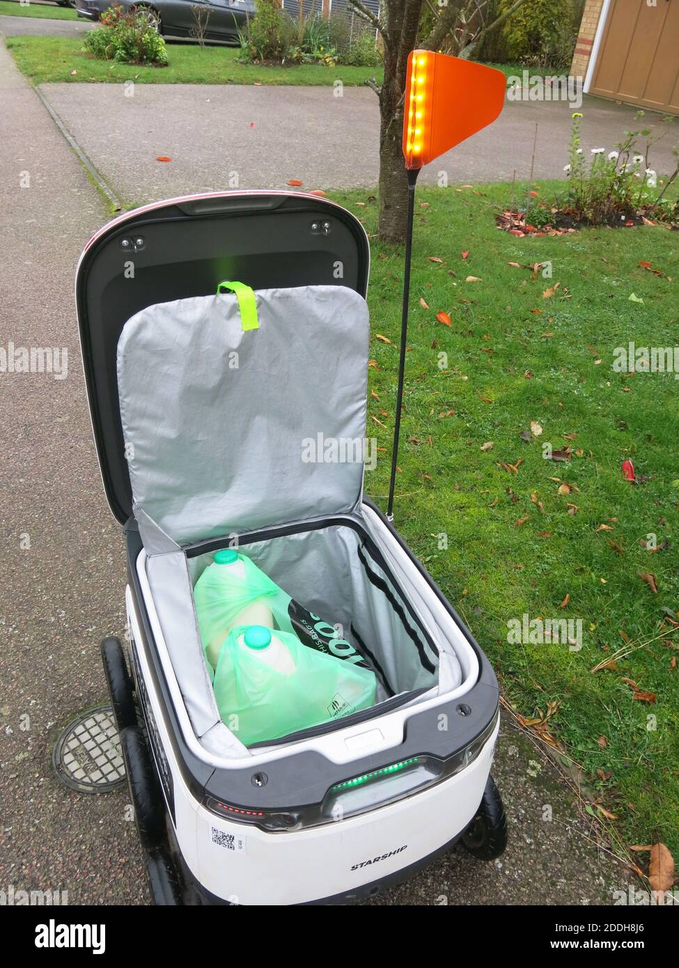 View of the Co-op groceries inside a Starship robot after the lid has been lifted on arrival at its destination: the future of online shopping. Stock Photo