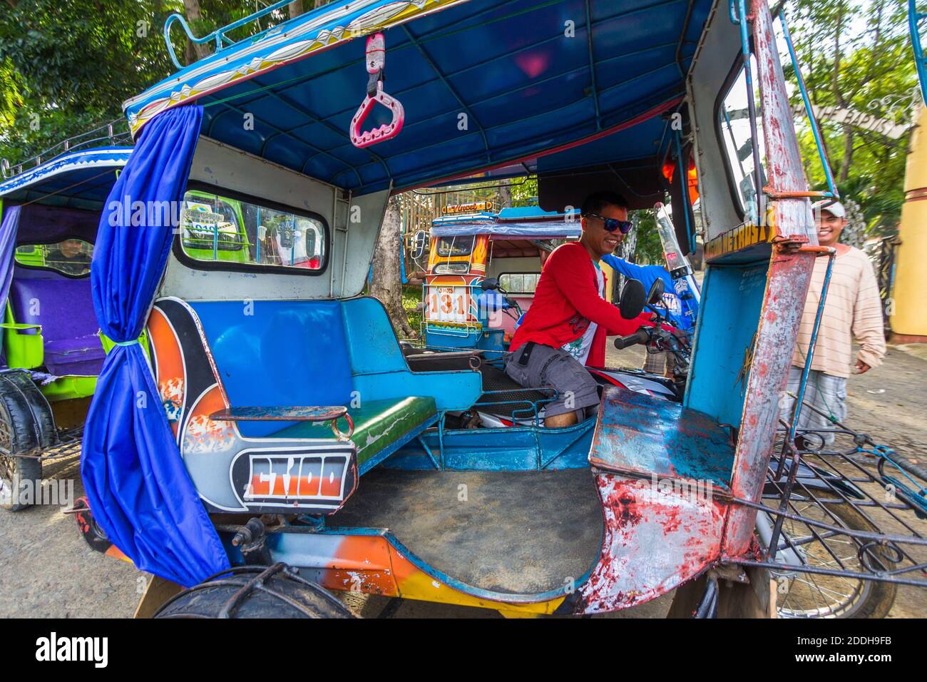 A custom built tricycle, a local passenger vehicle, in Mindanao, Philippines Stock Photo