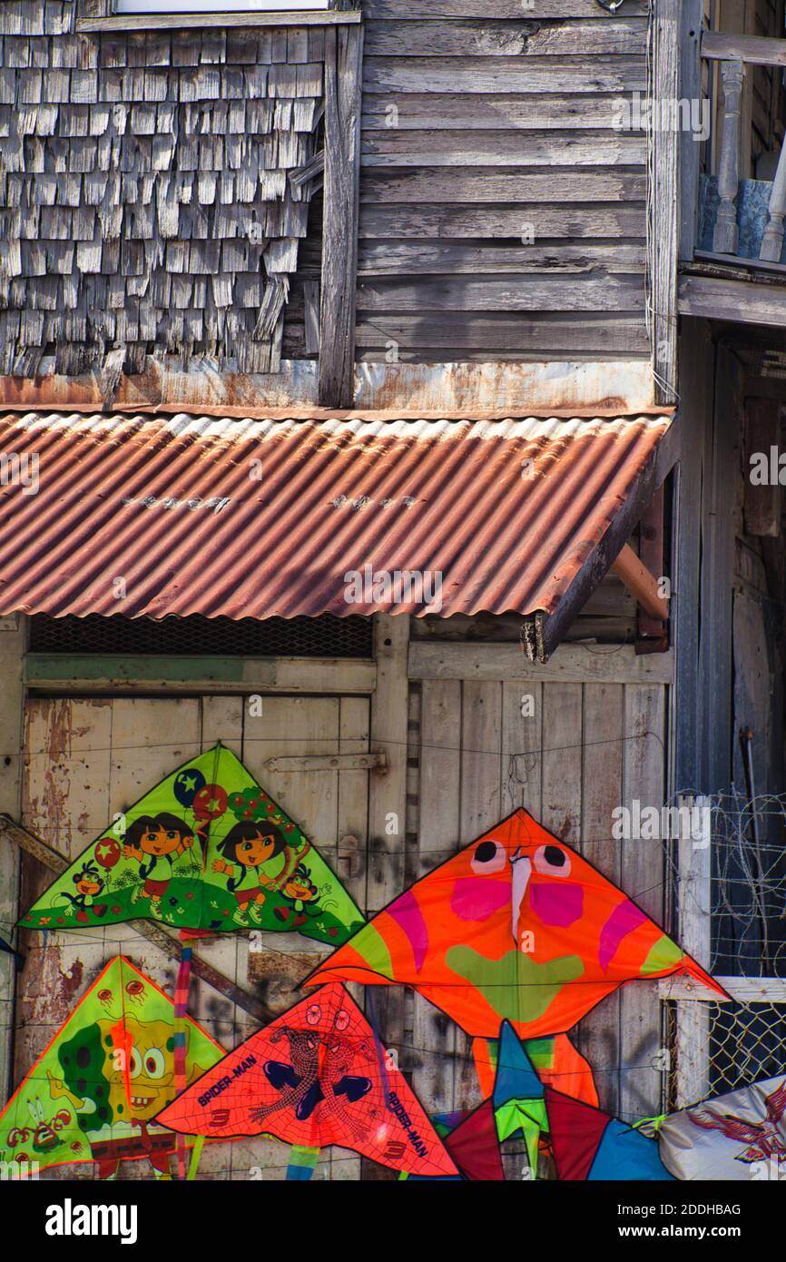 A local shack in Guyana with several decorative flying