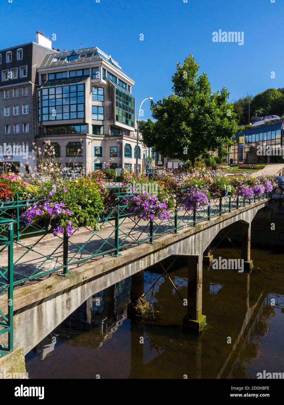 Bridge decorated with flowers over the River Odet in the centre of Quimper a city in Finistere Brittany north west France. Stock Photo