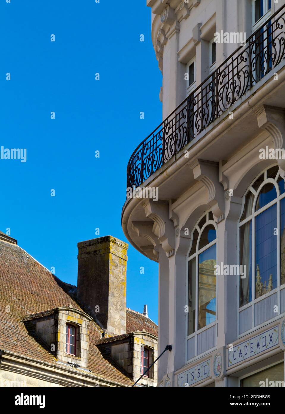 Detail of historic buildings with arched windows and wrought iron curved balcony in the city centre at Quimper Finisterre Brittany north west France Stock Photo
