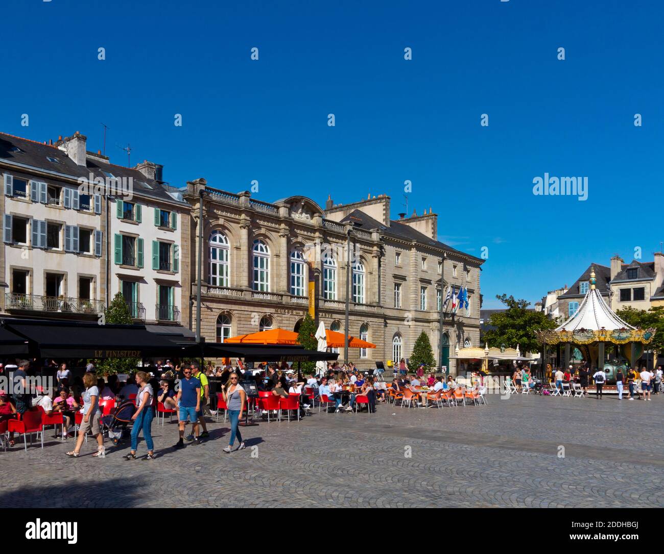 Summer visitors strolling in the streets near to the cathedral in Quimper city centre Finisterre Brittany north west France. Stock Photo