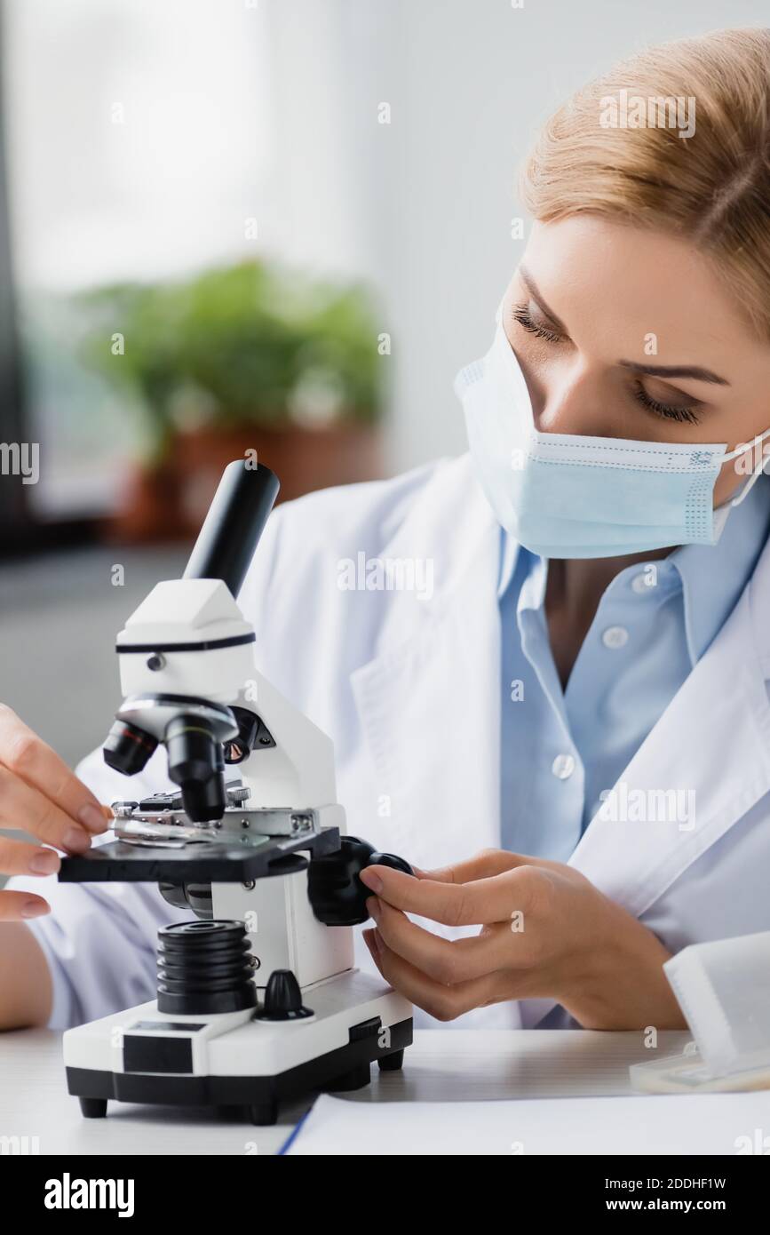 Female scientist using microscope table hi-res stock photography and ...