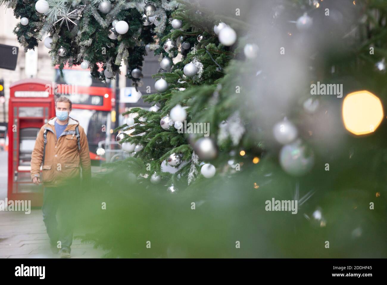 London, UK, 25 November 2020: Shops in London are shut and Harvey Nichols has neon window displays saying BAH HUMBUG and BRING ON 2021. London Mayor Sadiq Khan has said he wants London to be in Tier 2 of the post-lockdown restrictions.  Anna Watson/Alamy Live News Stock Photo