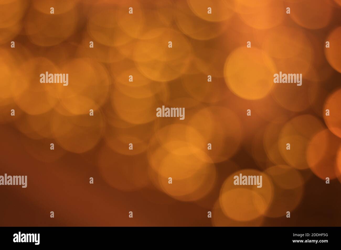 Abstract orange background with sparkling bokeh lights Stock Photo - Alamy