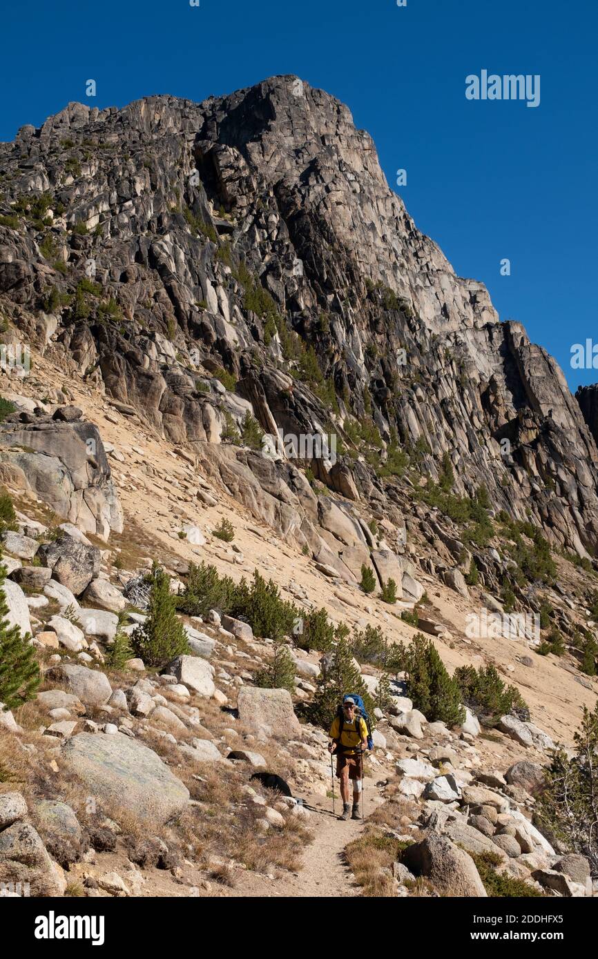 WA18987-00...WASHINGTON - Hiker approaching Cathedral Pass on the Boundary Trail in the Pasayten Wilderness. Stock Photo