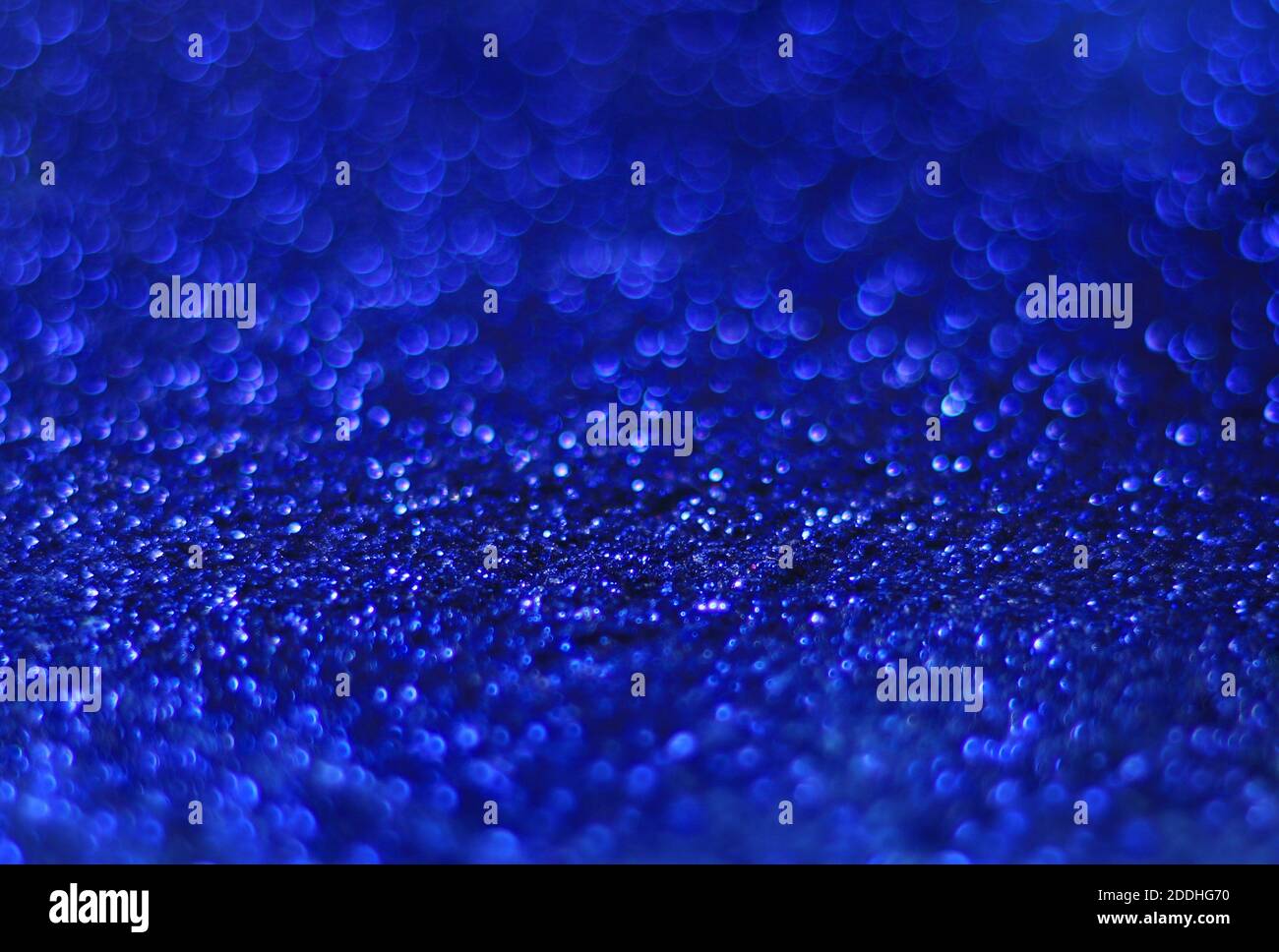An abstract blue background with glowing bokeh lights Stock Photo - Alamy