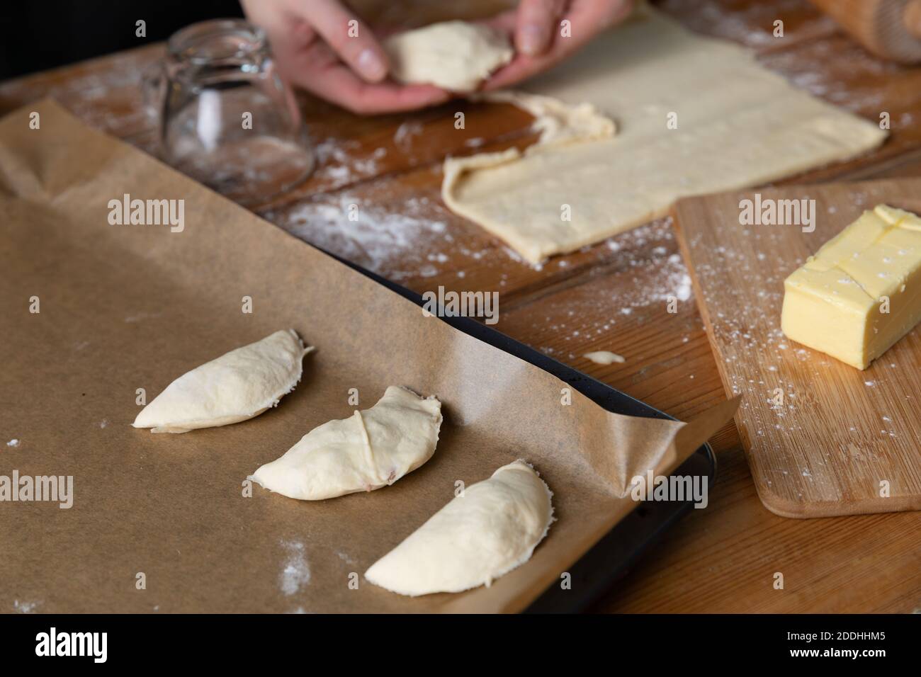 Women preparing homemade food pie, pizza in a cozzy kitchen. Hobbies and family life concept. Stock Photo