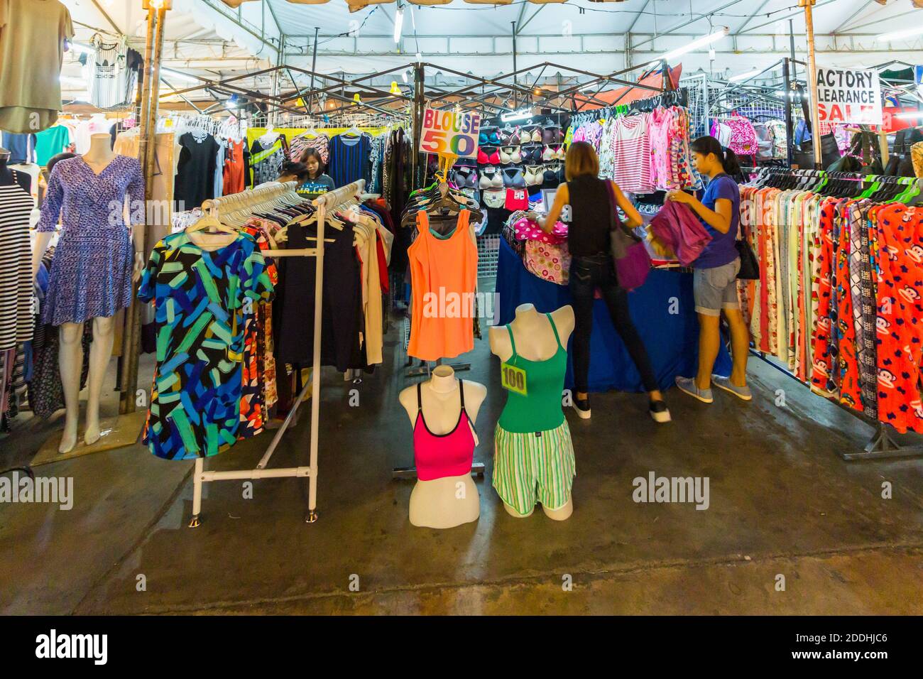 A clothes stall selling at a night market in Makati City, Philippines Stock Photo