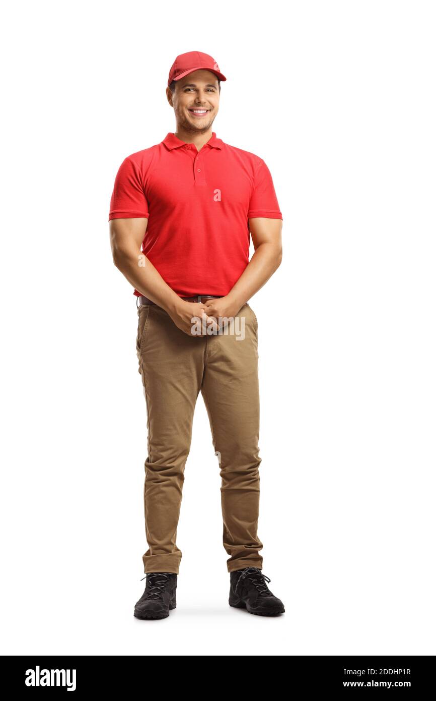 Full length portrait of a smiling man in a uniform and a red cap isolated on white background Stock Photo