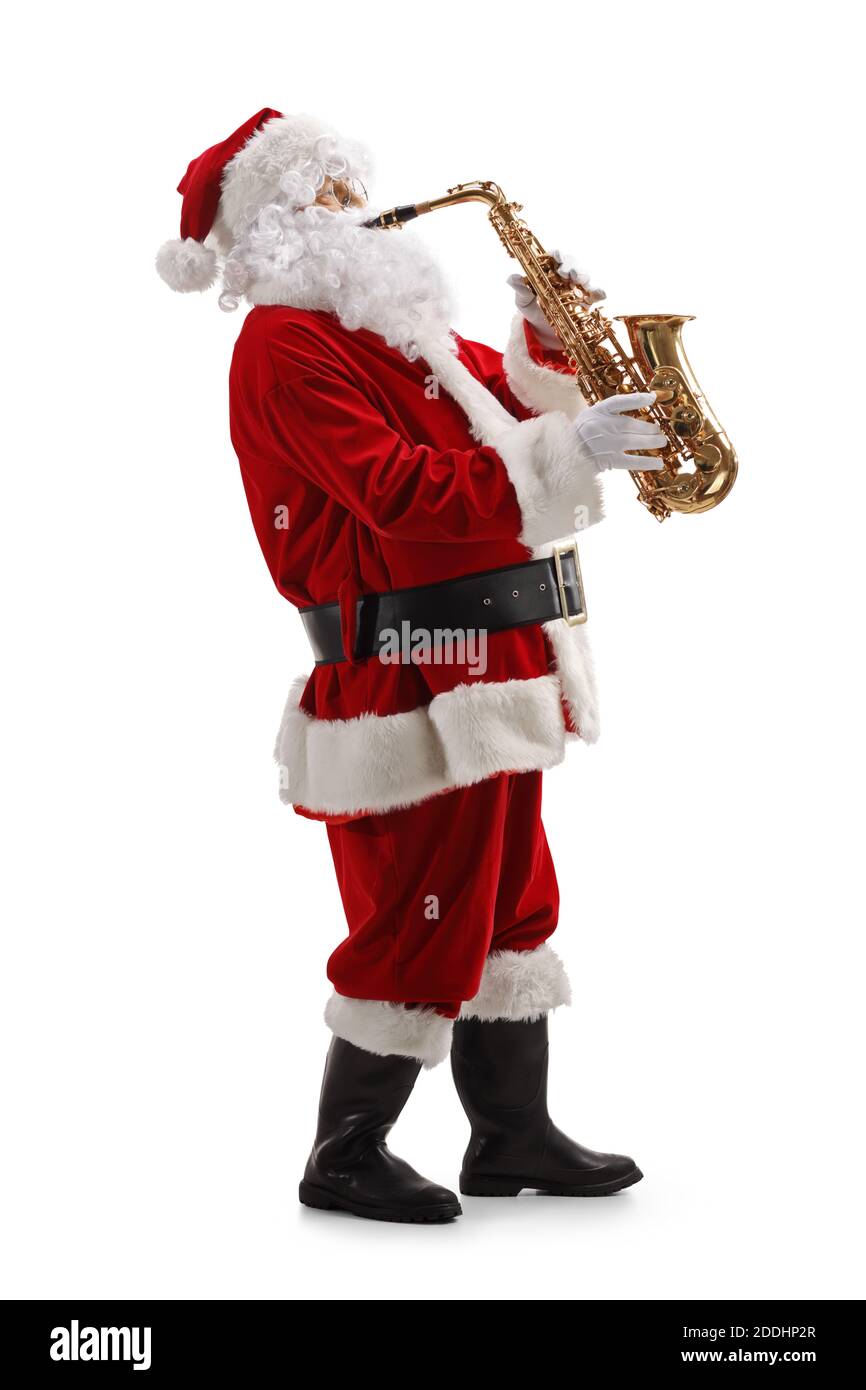 Full length profile shot of Santa playing a saxophone isolated on white background Stock Photo