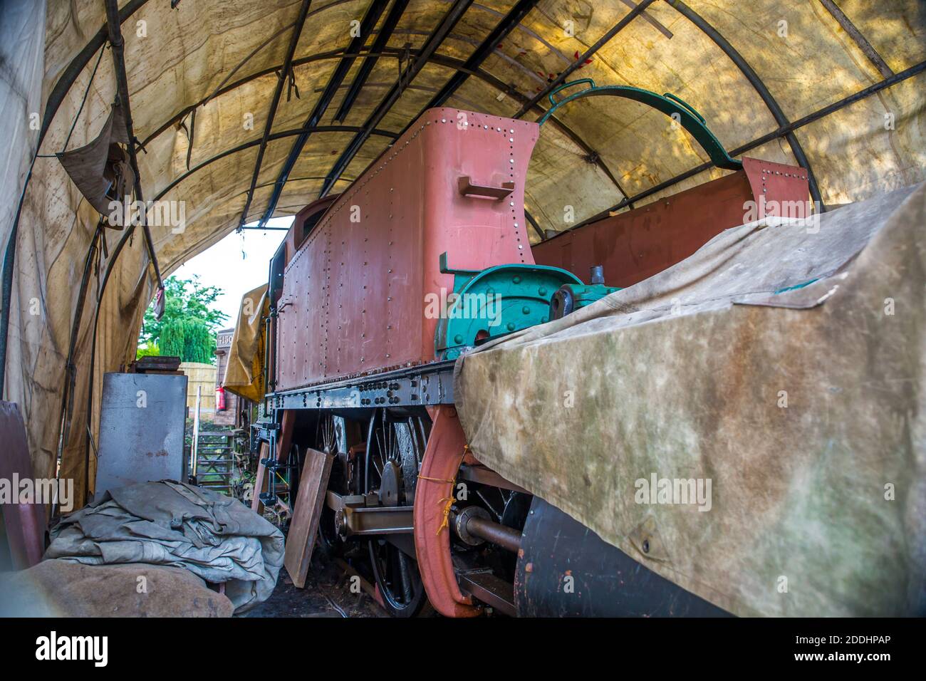 Close up of vintage UK steam engine under shelter being
