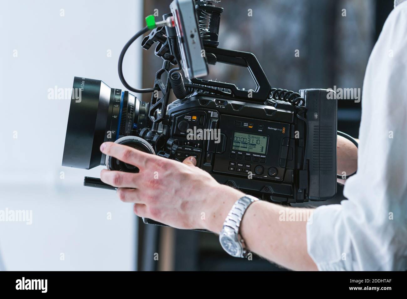 Kyiv, Ukraine - November, 2020: Close-up of male hand holding video camera Black Magic pocket cinema 4k with Carl Zeiss lens. Professional equipment f Stock Photo