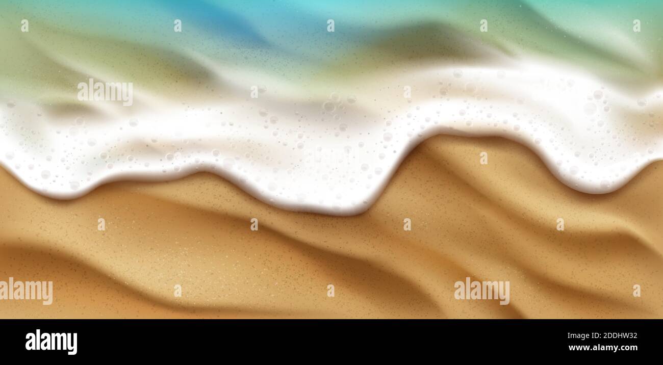 Top view of sea wave with foam splashing on beach with sand. Blue ocean ...
