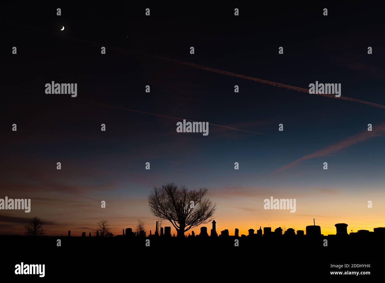 A waxing crescent moon over the Robertson Cemetery near Honeytown, IN.  This image is approximately 200MP. Stock Photo