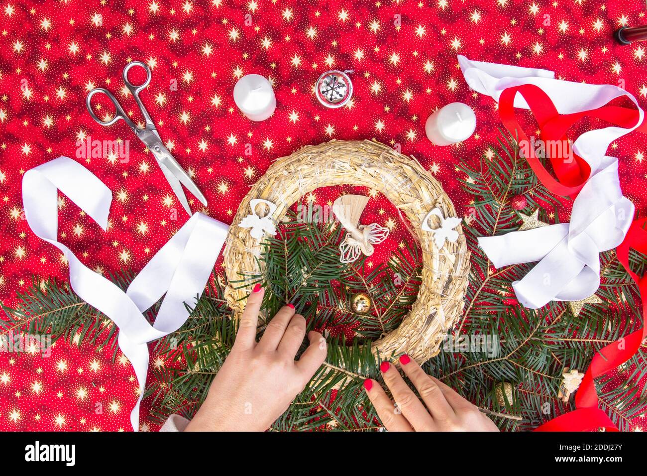 Handmade Christmas wreath with ribbons.Step by step, tutorial.Xmas colorful background.Winter holiday seasonal decor.Creating DIY project.Handcraft ac Stock Photo