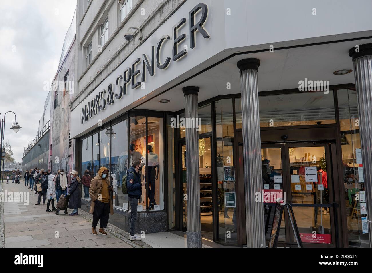 People queuing outside Marks & Spencer during the second UK Covid-19 lockdown on the 21st November 2020 in Brixton in London, England. Stock Photo