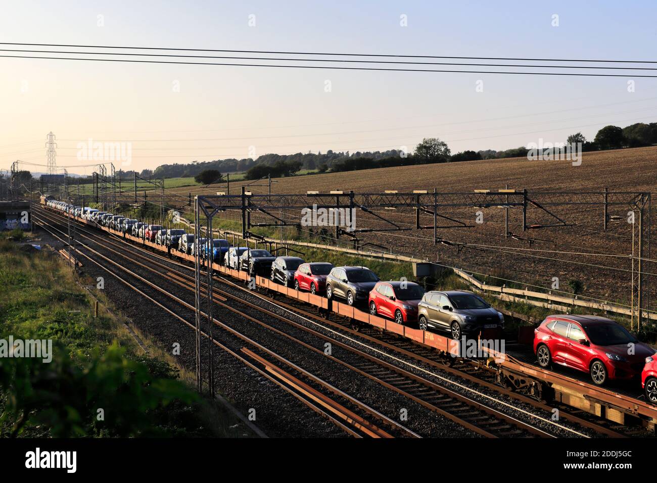 Car Transporter train near Berkhamsted town, West Coast Main Line, Hertfordshire County, England Stock Photo