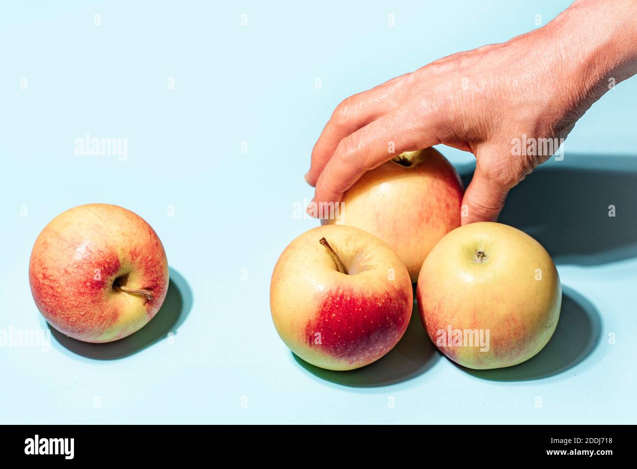 Apples on blue background art image Stock Photo