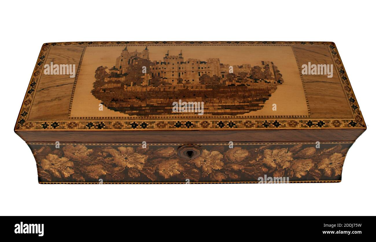 Tunbridgeware Glove Box, 1800-1900 This Tunbridgeware glove box was possibly made by Henry Hollamby of Tunbridge Wells around 1850-1860. The lid is decorated with a picture of Eton College which has been made from sticks of different woods, to make it look like a painting. The sticks are first cut and glued on to a paper backing which is then placed into a background of holly wood. Finally, it is set into a rosewood veneer which covers the carcass of the box. The sides of the box are covered with a version of a Berlin Woolwork pattern, normally found on tapestry. Social history, Wood Stock Photo