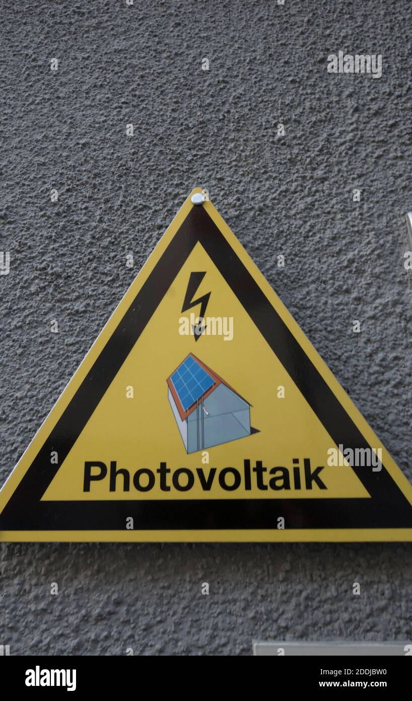 a building and photovoltaics sign, sustainable and ecological energy ...