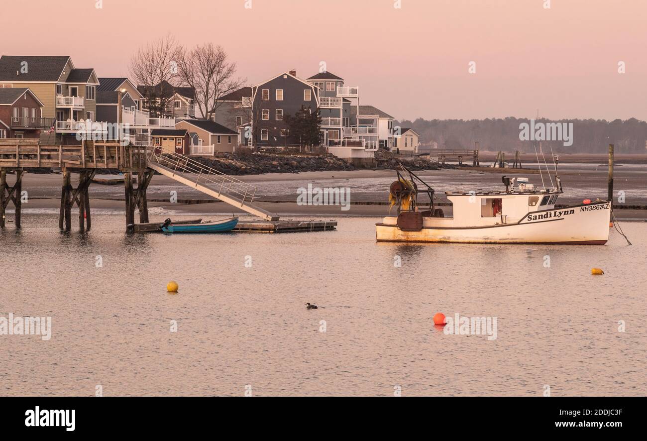 Seabrook Harbor is alive with fishing boats large and small. Waterfront dining here, and families in summer months too. Very busy in warmer weather . Stock Photo