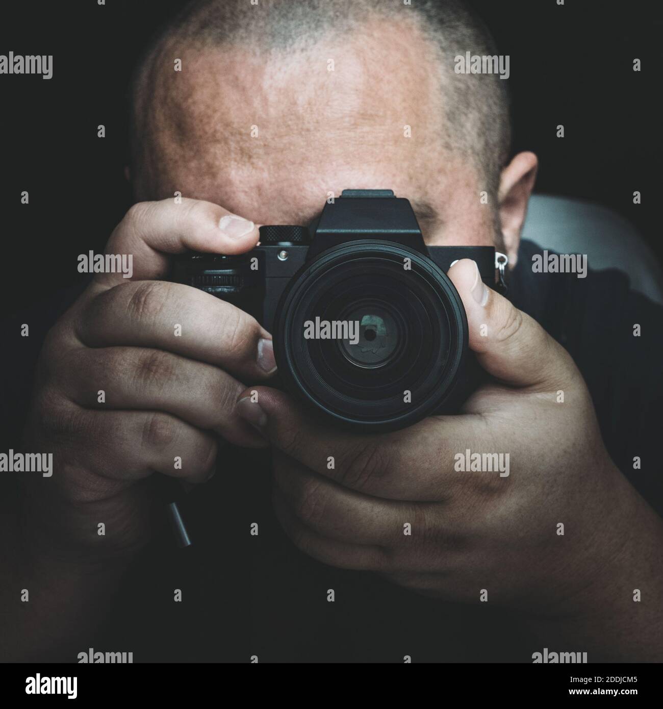 Portrait of man with camera, photographer or paparazzi or private investigator. Stock Photo