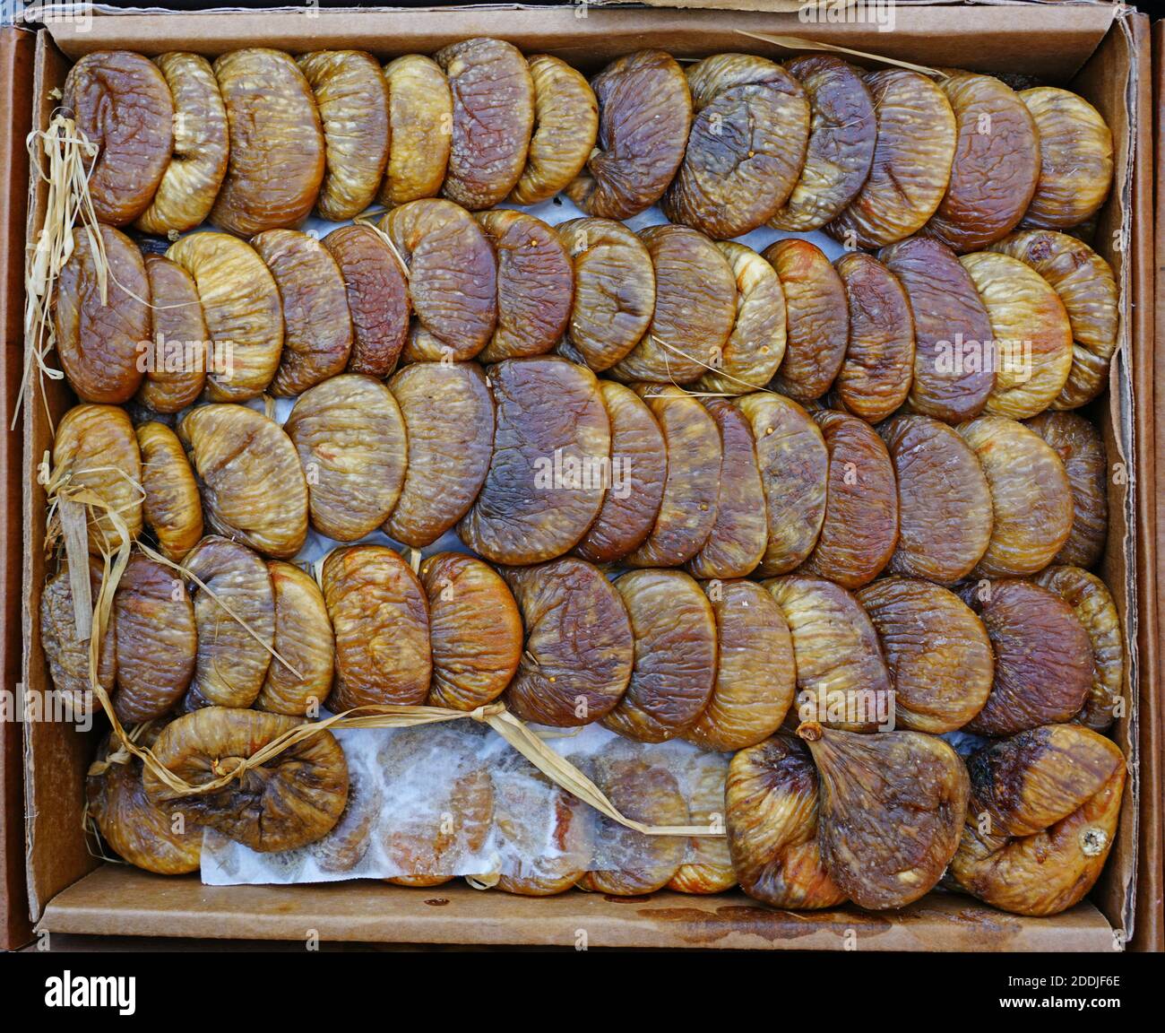 Box of plump dried figs at a market Stock Photo