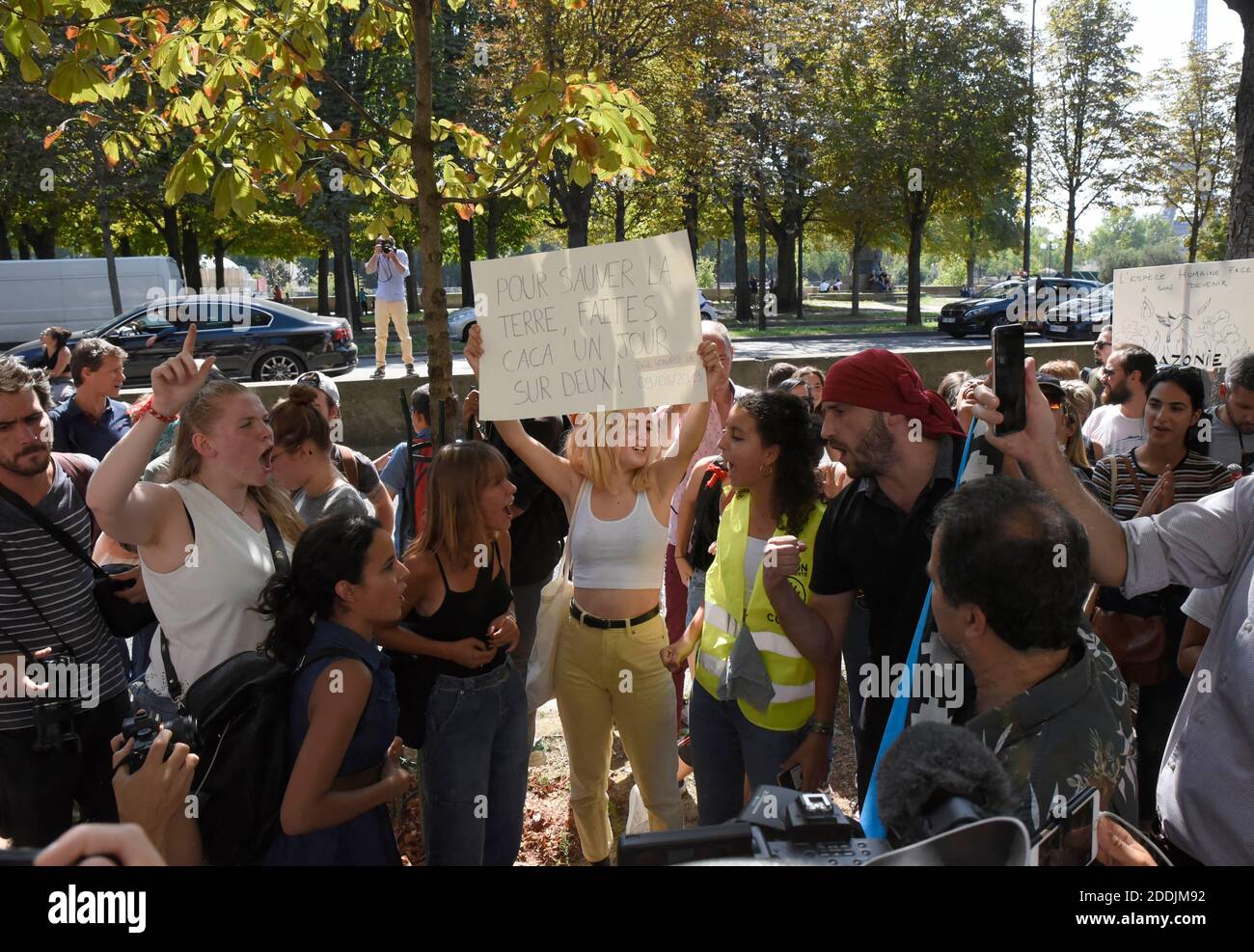 Climate activists demonstrate in front of the Brazilian Embassy in the  French capital Paris on August 23, 2018, calling on the Brazilian president  to do more to halt the fires in the