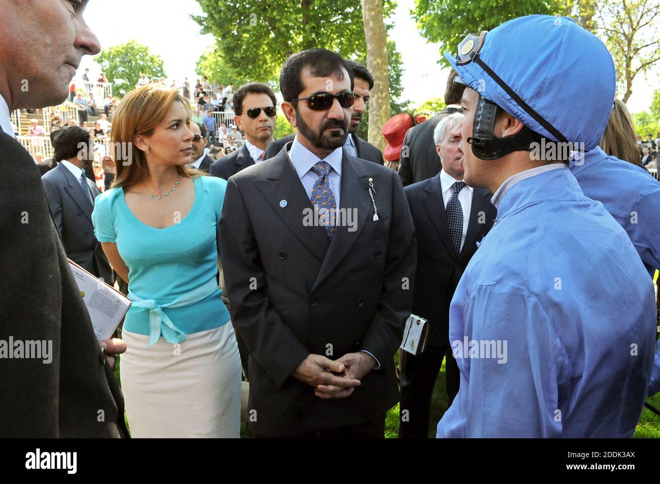 File photo - Jordan's Princess Haya and her husband, Dubai's ruler, Sheikh Mohammed Bin Rashed Al Maktoum talk with Italian jockey Lanfranco 'Frankie' Dettori as they attend colts race, known as 'Poule d'Essai des Poulains' at Longchamp racecourse in Paris, France, on May 11, 2008. The younger wife of the ruler of Dubai, the billionaire race horse owner Sheikh Mohammed bin Rashid al-Maktoum, is believed to be staying in a town house near Kensington Palace after fleeing her marriage. Princess Haya bint al-Hussein, 45, has not been seen in public for weeks. One half of one of the sporting world’ Stock Photo