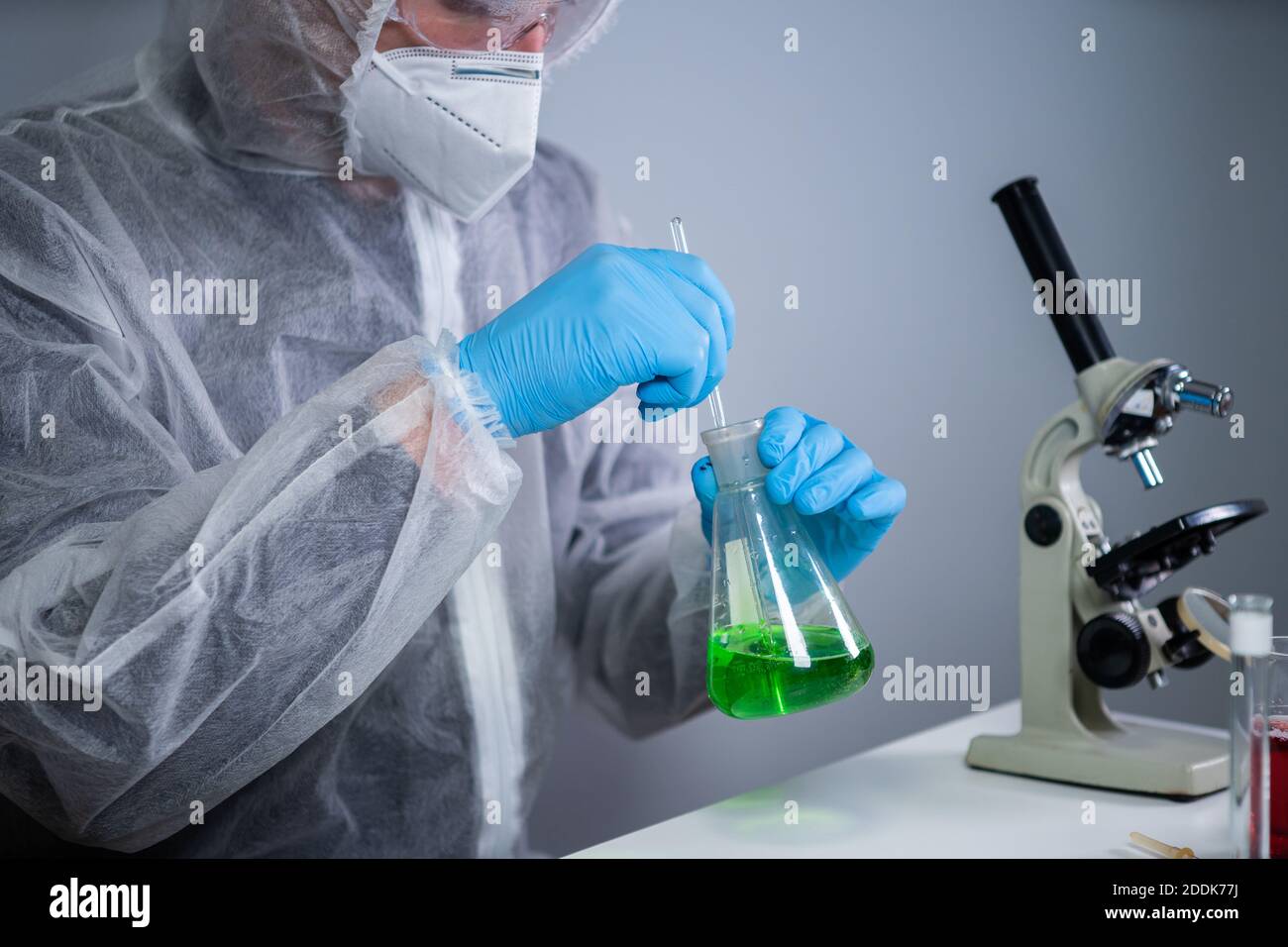 Medical scientist studying reaction in hi-res stock photography and ...