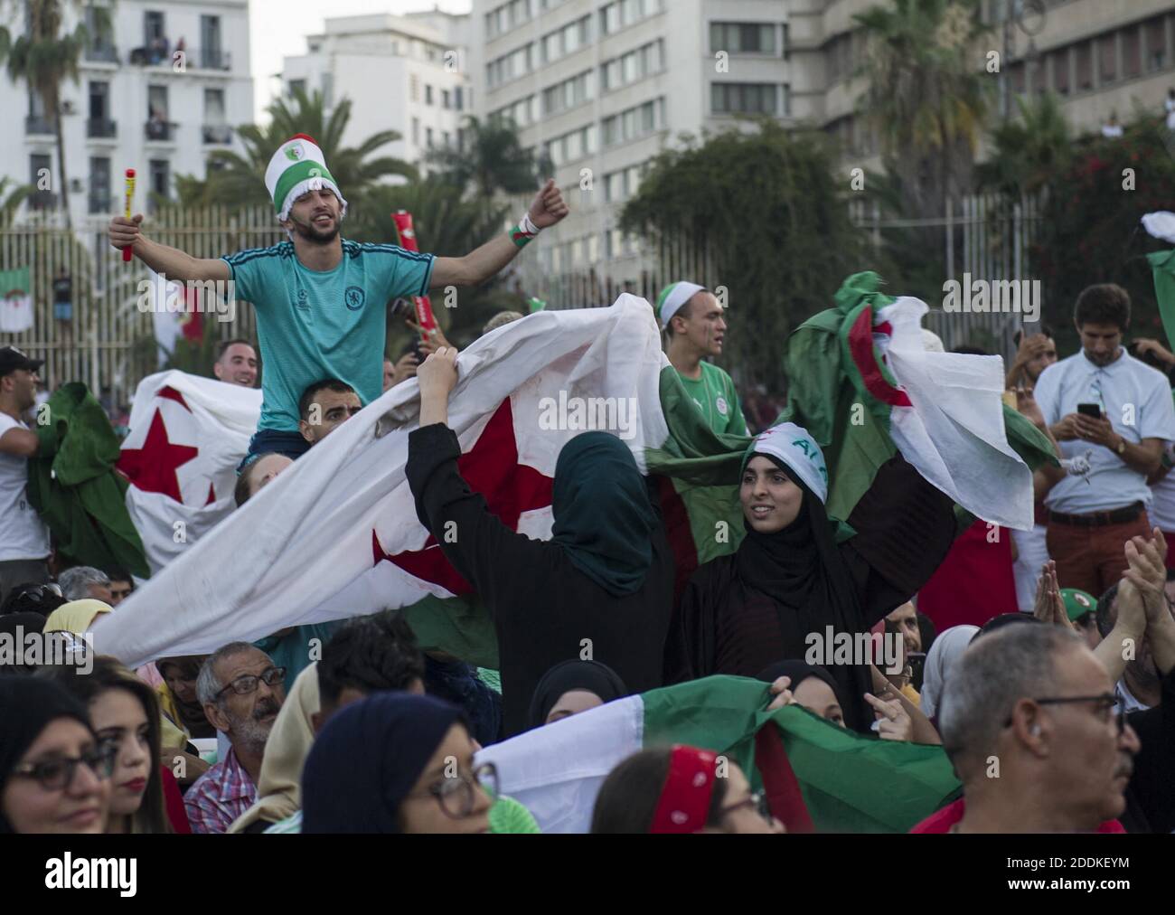Algeria supporters celebrate after Algeria won the 2019 Africa Cup of Nations (CAN) semi-final football match against Nigeria, on the Grande Poste place in Algiers on July 14, 2019. Riyad Mahrez rifled in a stoppage-time free-kick to earn Algeria a dramatic 2-1 victory over three-time champions Nigeria on July 14 and set up a rematch with Senegal in the Africa Cup of Nations final. Photo by Louiza AmmI/ABACAPRESS.COM Stock Photo