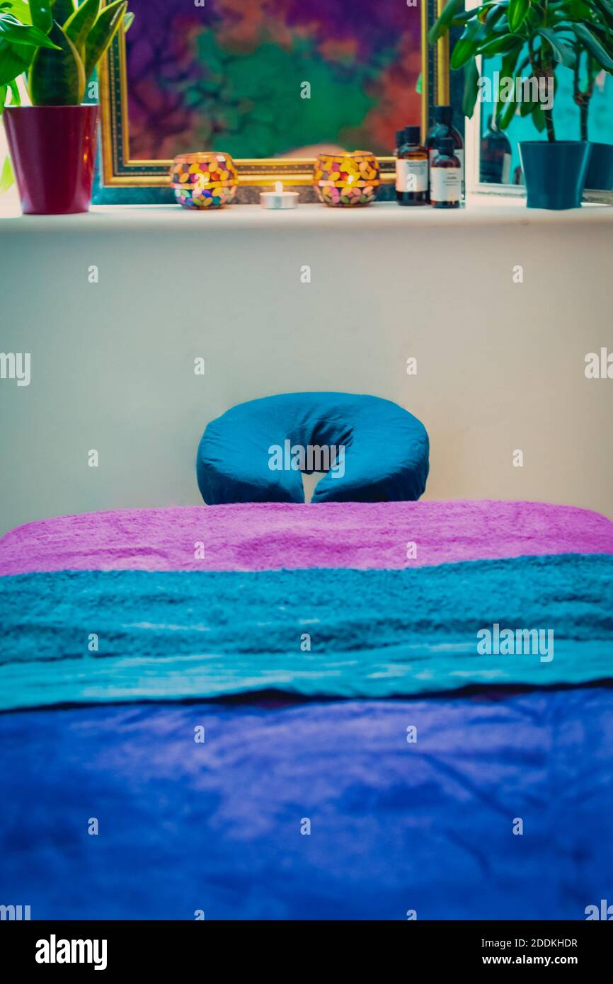 A closeup vertical shot of an empty massage table bed in a spa salon Stock Photo