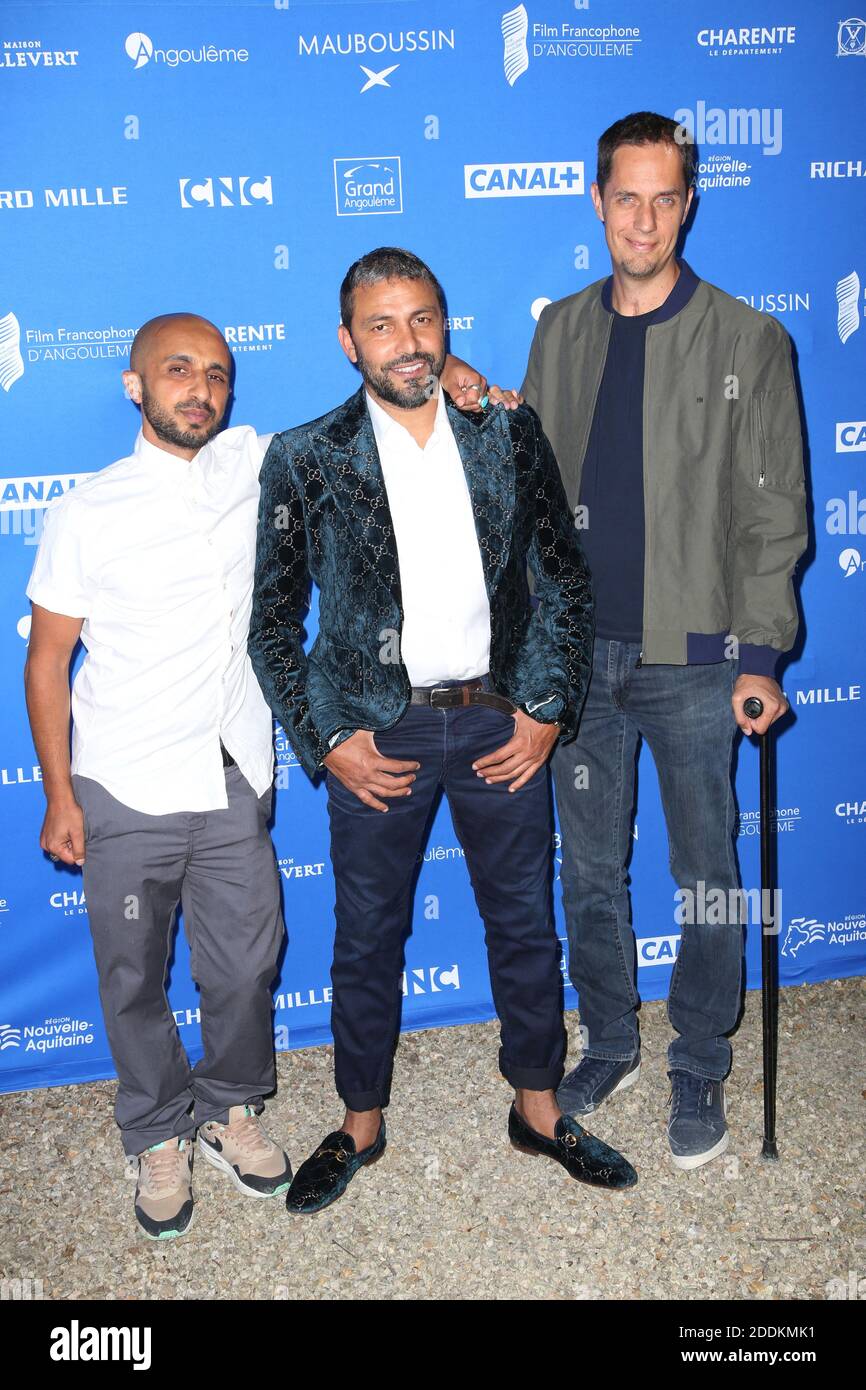 Mehdi Idir, Jean-Rachid and Grand Corps Malade pose at the La vie Scolaire  Photocall as part of the 12th Angouleme Film Festival in Angouleme, France  on August 22, 2019. Photo by Jerome