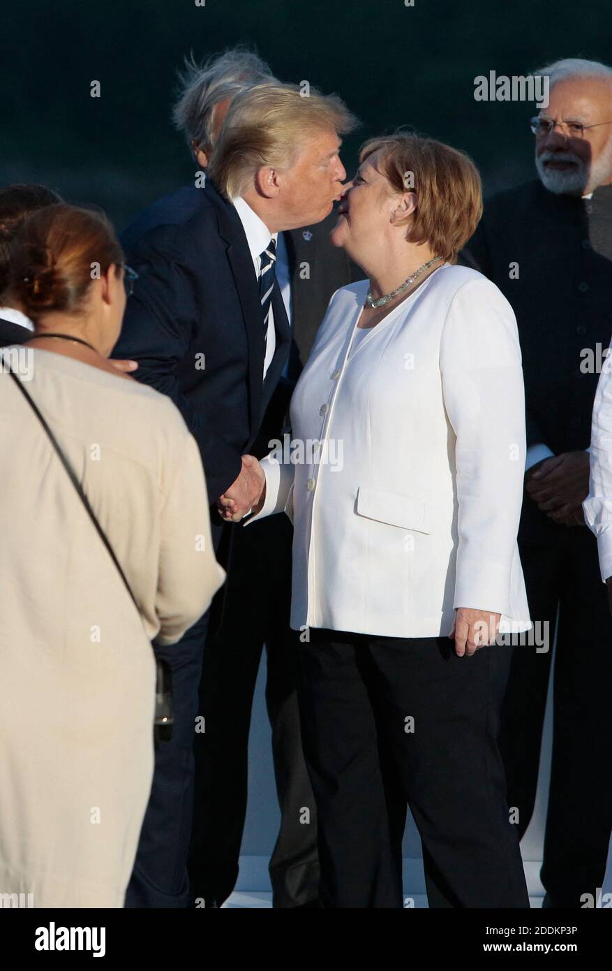 US President Donald Trump and German Chancellor Angela Merkel arrive for a family picture on the second day of the annual G7 summit in Biarritz, France, August 25, 2019. France on August 25, 2019. Photo by Patrick Aventurier/ABACAPRESS.COM Stock Photo